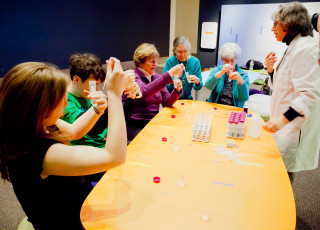 Participants take part in a science activity at a table.