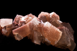 Cluster of rhombohedral calcite crystals.