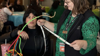 two people measure a STEM activity creation.