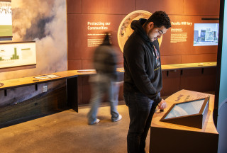 Guests explore the Climate of Hope exhibit at NHMU