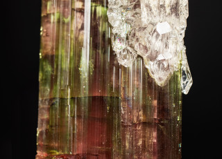 Quartz crystals grow on the surface of elbaite crystals.