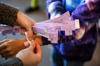Wristbands are given to students.
