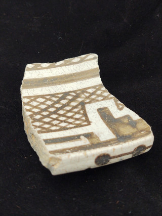 A black and white pottery sherd