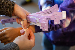 Student getting their field trip wristband