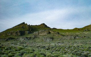 A hilly landscape that is the location of Homestead Cave.