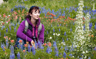 The artist in a field of flowers.