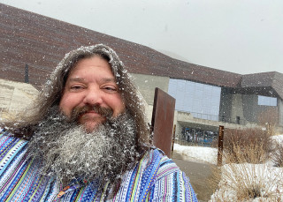 Mark outside the Museum in the snow.