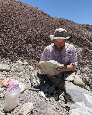 A paleontologist works in the field. 