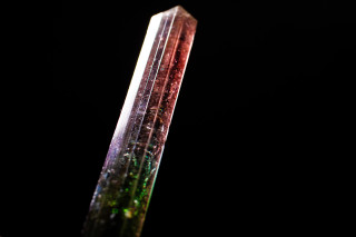 Elbaite crystal that is green at the base and grades to red near the tip of the crystal.