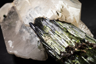 Quartz encloses the end of a tourmaline crystal.