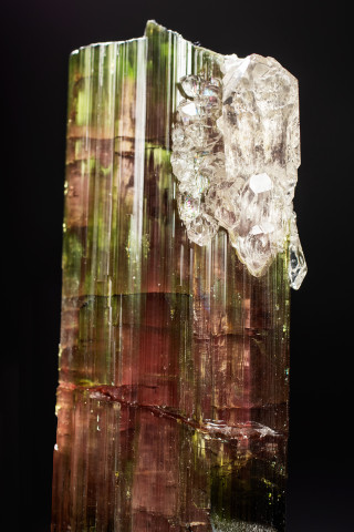 Quartz crystals grow on the surface of elbaite crystals.