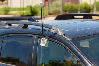 An antenna on a car window.