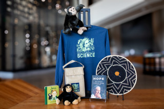 A selection of Jane Goodall themed gifts, including books and a Jane tshirt.