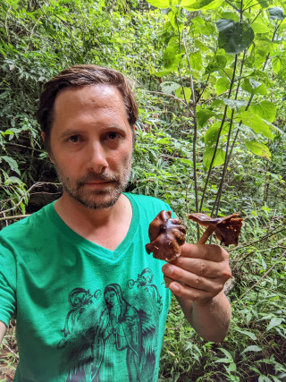 Bryn Dentinger holds fungi