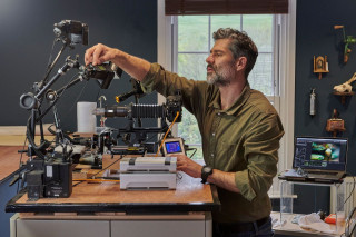 Photographer Levon Biss working in his studio. 