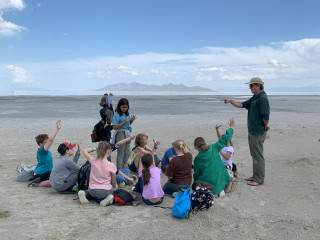 Doug Tolman talking with a group of students at the Great Salt Lake.