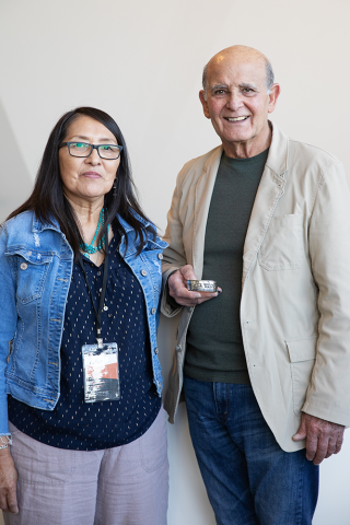 George Sumner and Rosabelle Shepherd at NHMU Holding Storyteller Bracelet