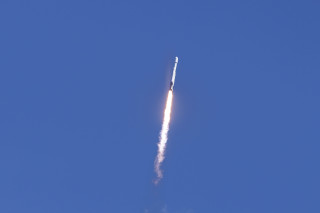 A rocket flying through the sky.