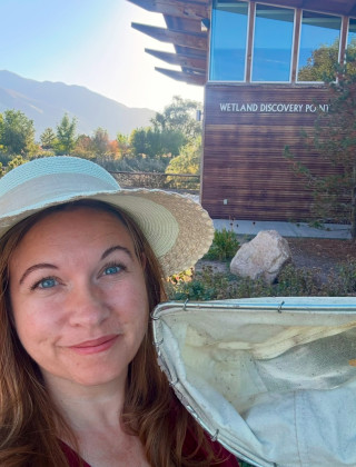 Sarah Erwin, Associate Professor with Utah State University Extension, holding a dip net.