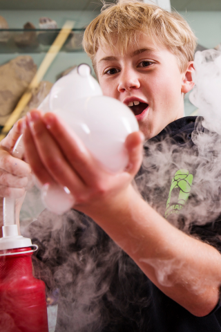 kid conducting a science experiment