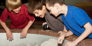 youth playing with sand