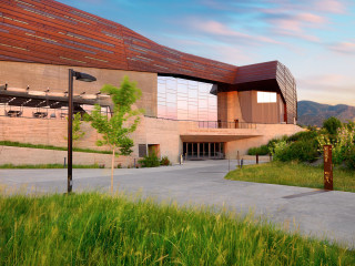 field_thumbnail/0/title Exterior of the Museum below hills.