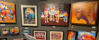 A booth full of paintings. 
