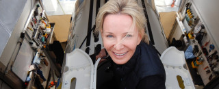 Susan Casey enters a submarine. 
