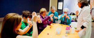 Participants take part in a science activity at a table.