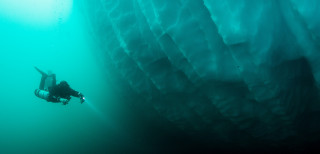 Jill Heinerth dives below an iceberg. 