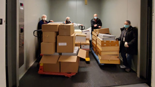 NHMU Volunteers move objects through the Museum.