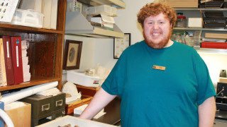 NHMU Volunteer Cody Bedke works in the entomology lab. 