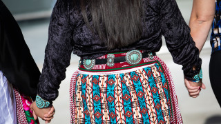 Dancers in traditional Native American attire. 