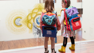 Two girls explore UMFA with sensory bags. 