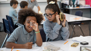 Two students investigate animals specimens
