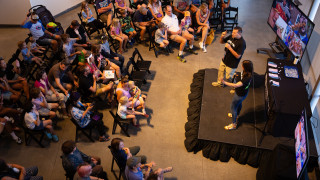 Museum staff speak to an audience
