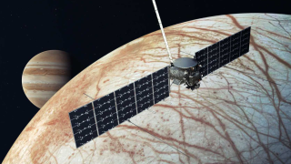 Artist&#039;s concept of the Europa Clipper over Europa.