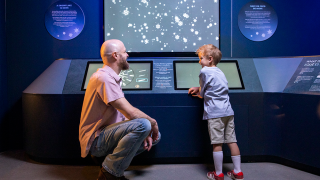 father and son play in nhmu&#039;s mysteries of the ice ages