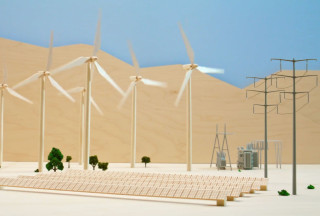A model of wind turbines and a solar farm. 