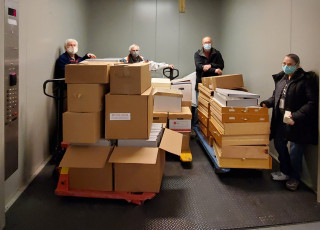 NHMU Volunteers move objects through the Museum.