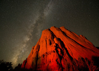 Milky Way over red rocks in the desert. 