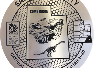 San Juan County marker featuring a dinosaur