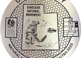 Uintah County marker featuring a dinosaur fossil
