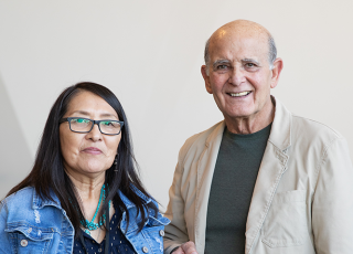 George Sumner and Rosabelle Shepherd at NHMU Holding Storyteller Bracelet