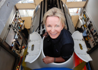 Susan Casey enters a submarine. 